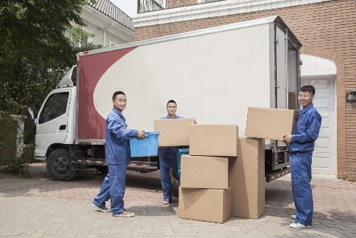Man and van moving furniture through a Shoreditch street