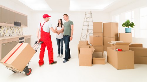 Moving boxes and furniture in a Shoreditch apartment building