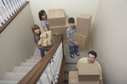 Local house movers delivering boxes and furniture into a Shoreditch home with organised unloading